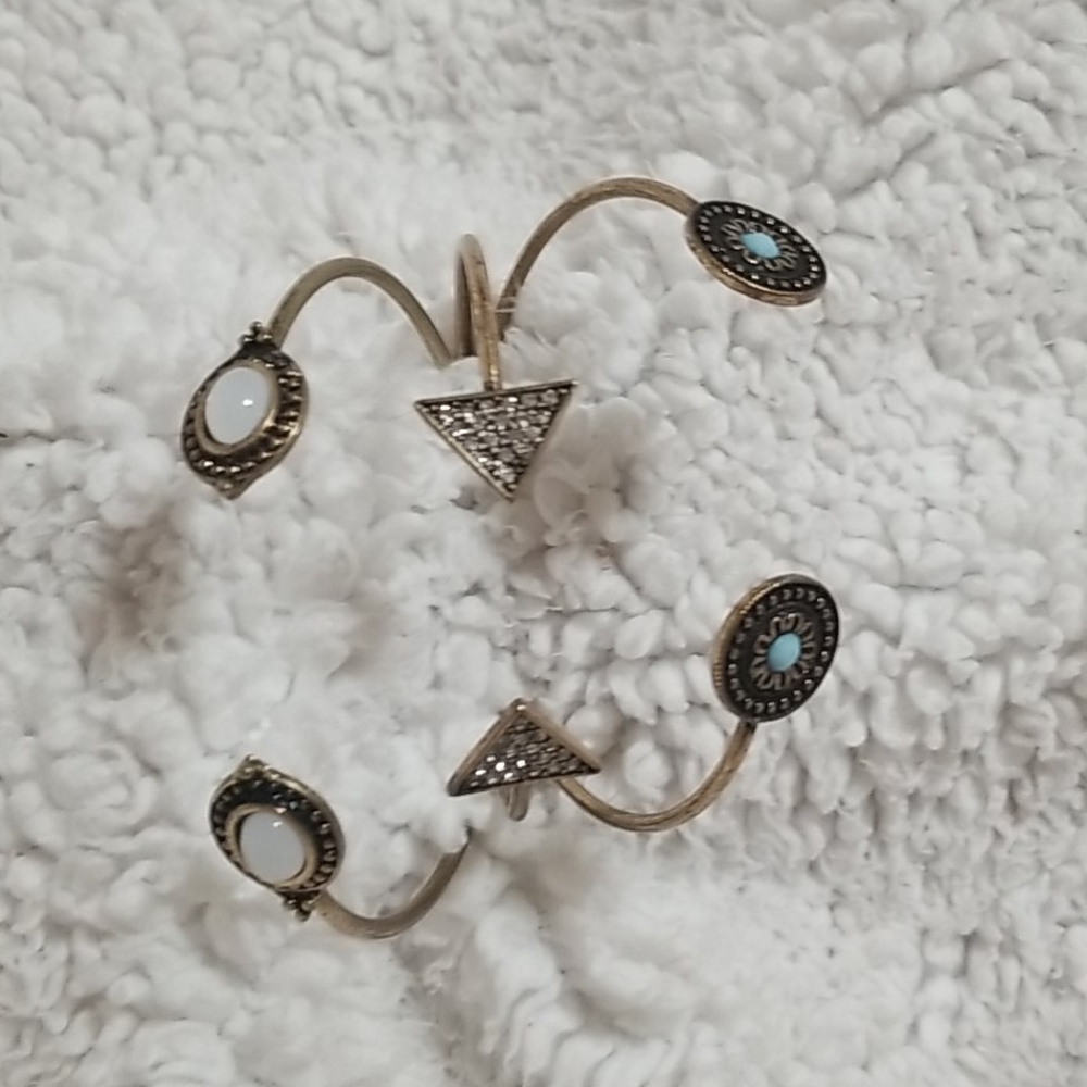 three gold bracelets